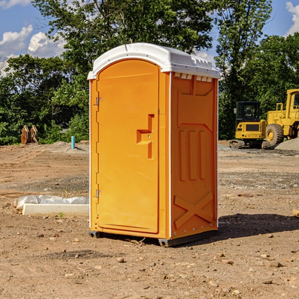 what is the cost difference between standard and deluxe portable restroom rentals in Adams OK